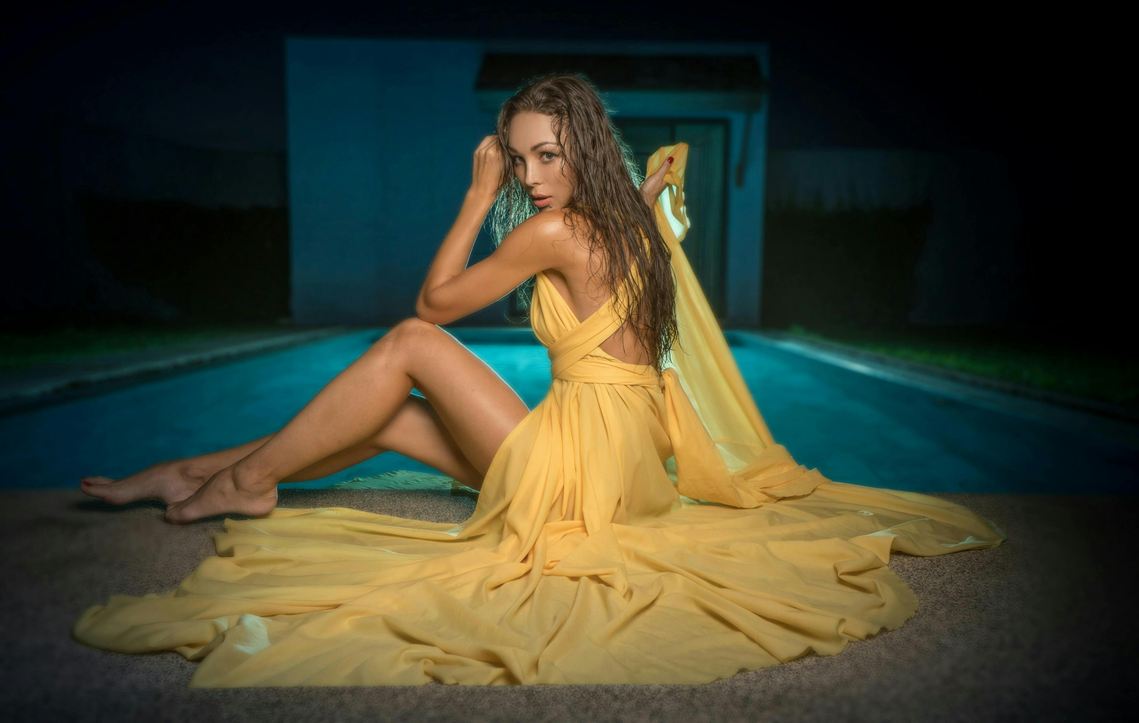 makeup,dress,woman,beauty,caucasian,bright,skin,slim,yellow,body,cute,long,summer,beautiful,chic,swimming,hair,outfit,brunette,dark,vacation,model,coctail,female,elegant,luxurious,pretty,attractive,sensual,sexy,one,pool,rich,girl,glamour,look,apartament,glowing,gorgeous,charming,lady,luxury,style,evening,party,posing,villa,fashion dress evening dress formal wear fashion adult female person woman sitting gown