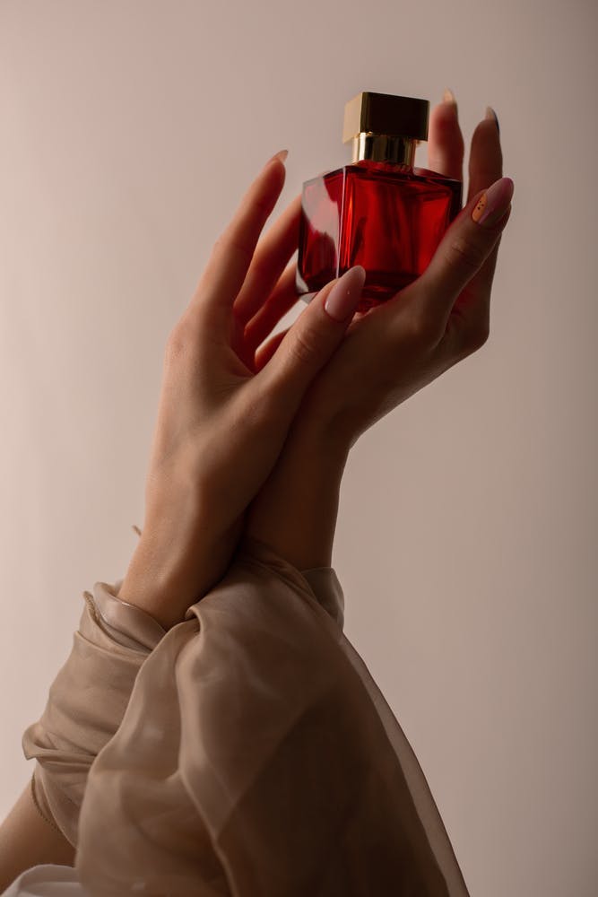 hands,beauty,young,essence,bottle,odor,body,smell,perfume,beautiful,scent,cosmetic,female,applying,product,spray,aromatic,glamour,elegance,perfumery,closeup,perfume bottle,person,luxury,style,aroma,essential,fashion,women body part finger hand person bottle cosmetics perfume